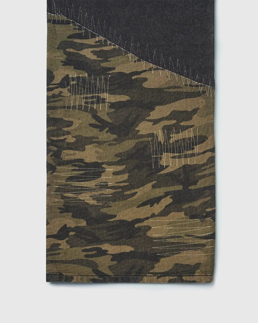 Flation Camo Digital Printing Baggy Jeans showing camouflage pattern, loose fit, and streetwear style on a beige background.