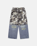 Patchwork effect print baggy jeans by Flation featuring colorful patchwork design and relaxed fit, casual streetwear style.