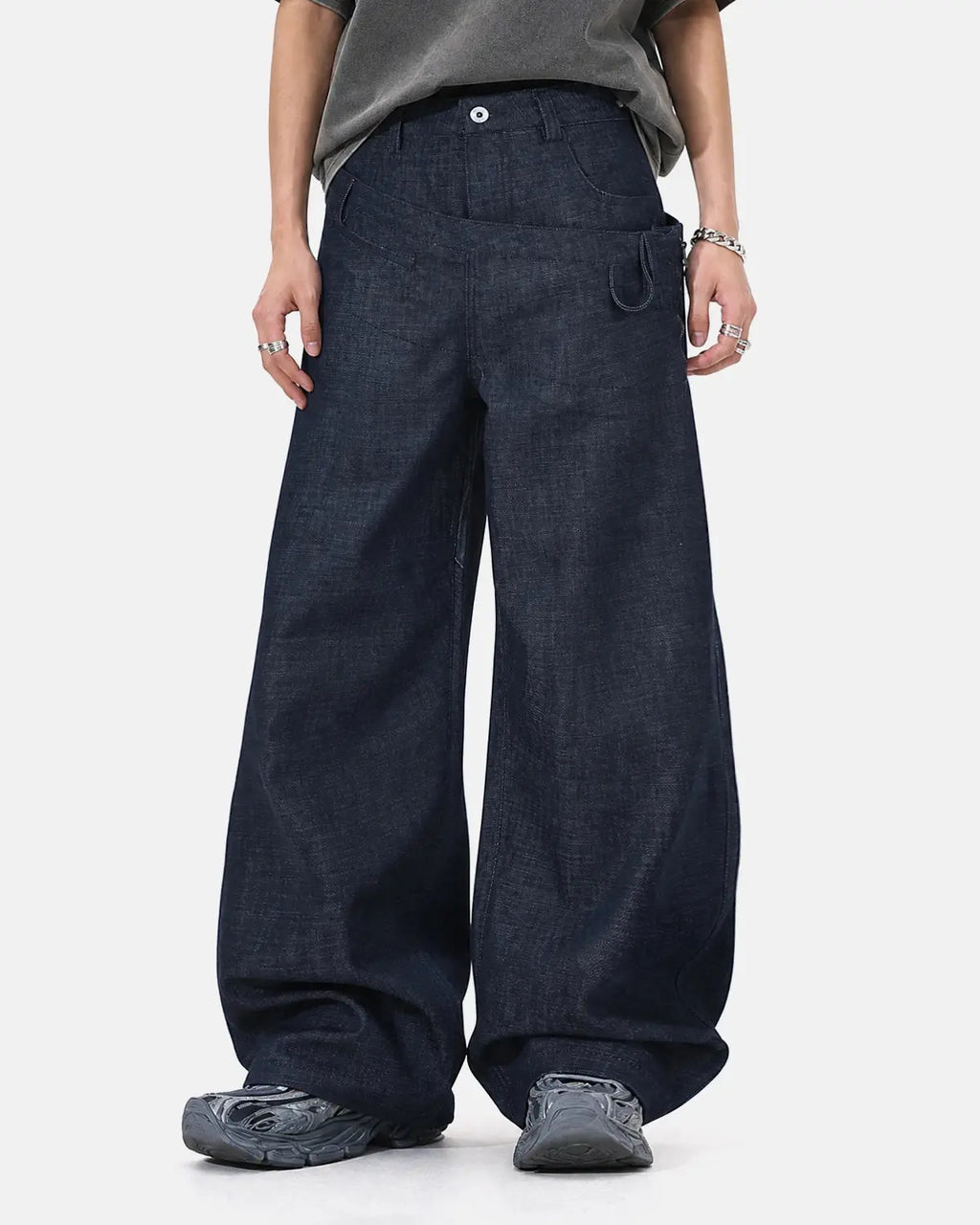 Inflation streetwear asymmetric wrap waist baggy jeans with relaxed fit and unique design, shown on a model.