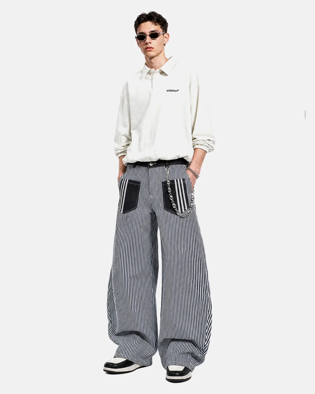 Flation striped patch pocket baggy jeans showing relaxed fit, bold stripe pattern, and patch pockets on denim fabric.