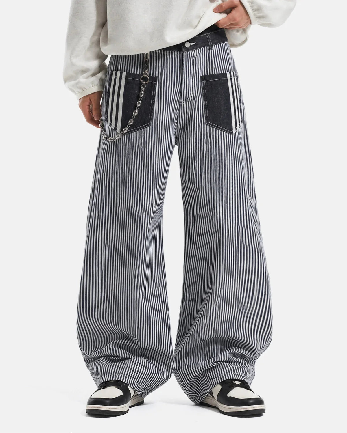 Flation striped patch pocket baggy jeans with relaxed fit, featuring colorful vertical stripes and large front patch pockets.
