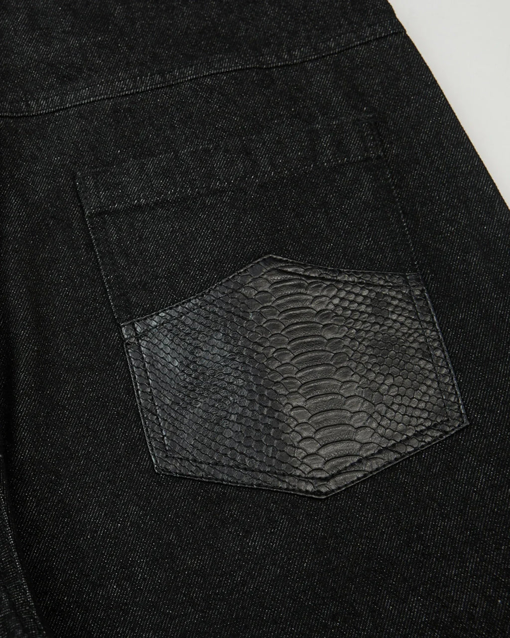Black baggy long jorts by Flation Streetwear, featuring loose fit denim shorts with frayed hems and casual street style.