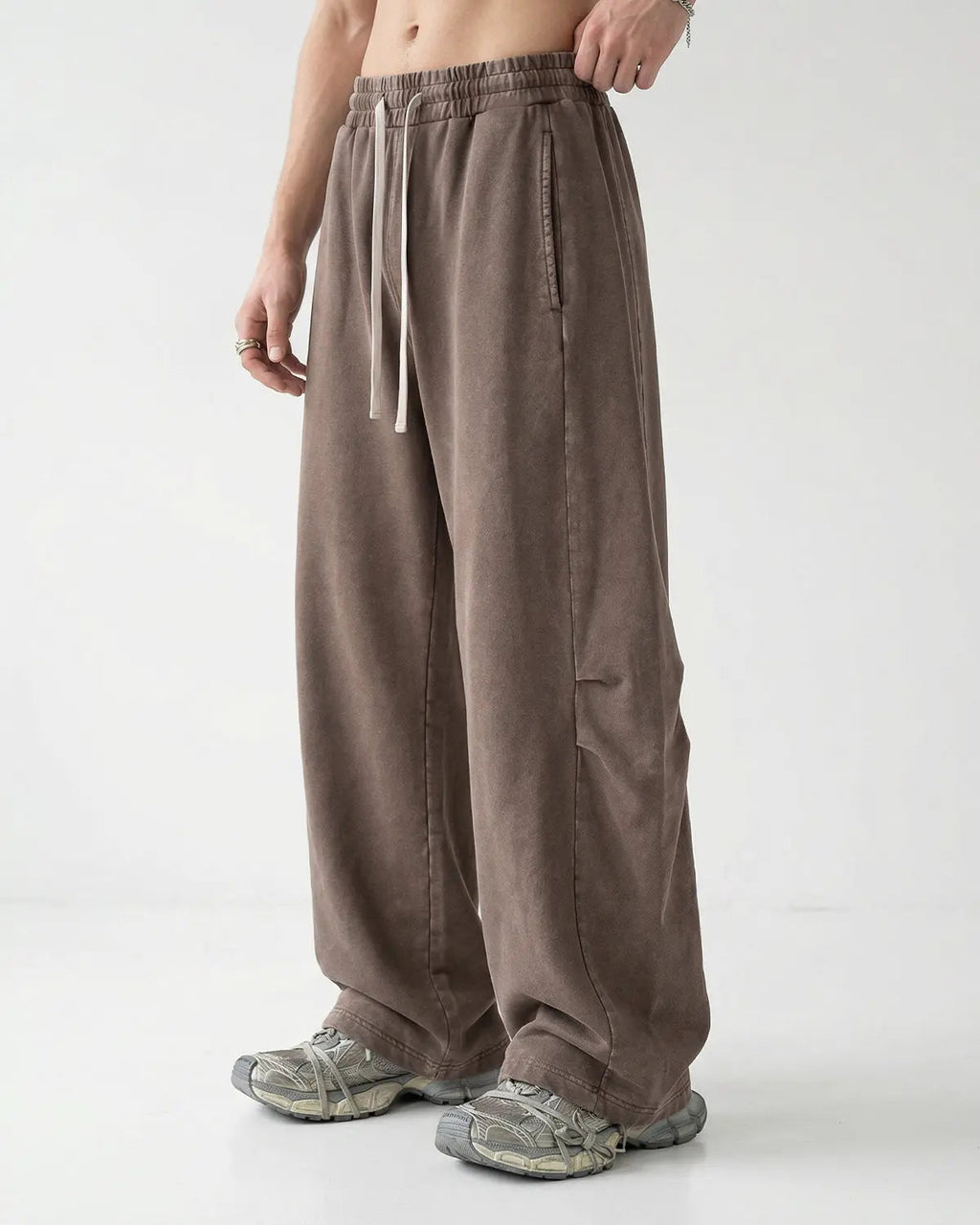 Khaki distressed acid-washed barrel sweatpants by Flation Streetwear, relaxed fit with a worn, vintage look.