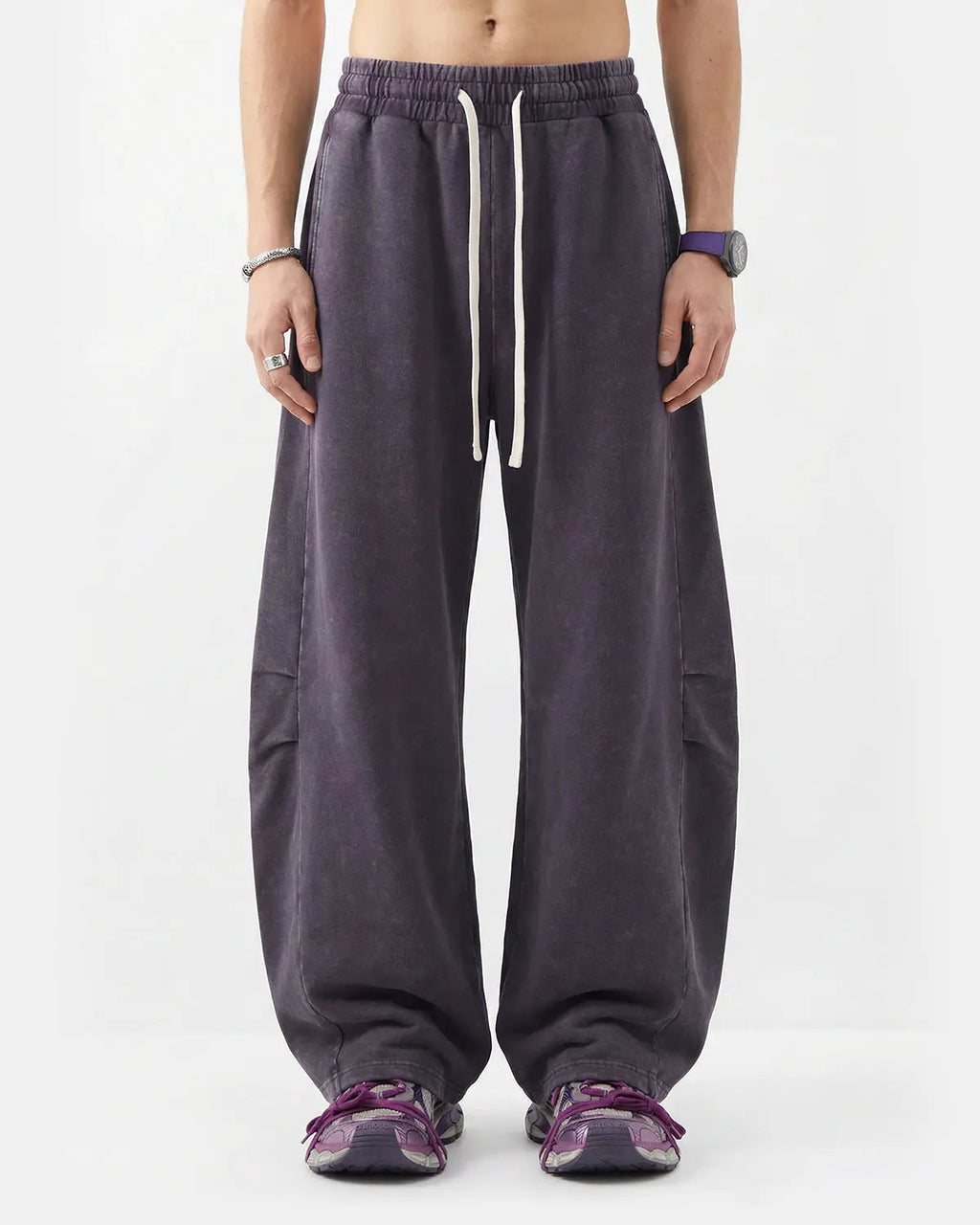 Khaki distressed acid washed barrel sweatpants by Flation Streetwear, showcasing relaxed fit and rugged texture.