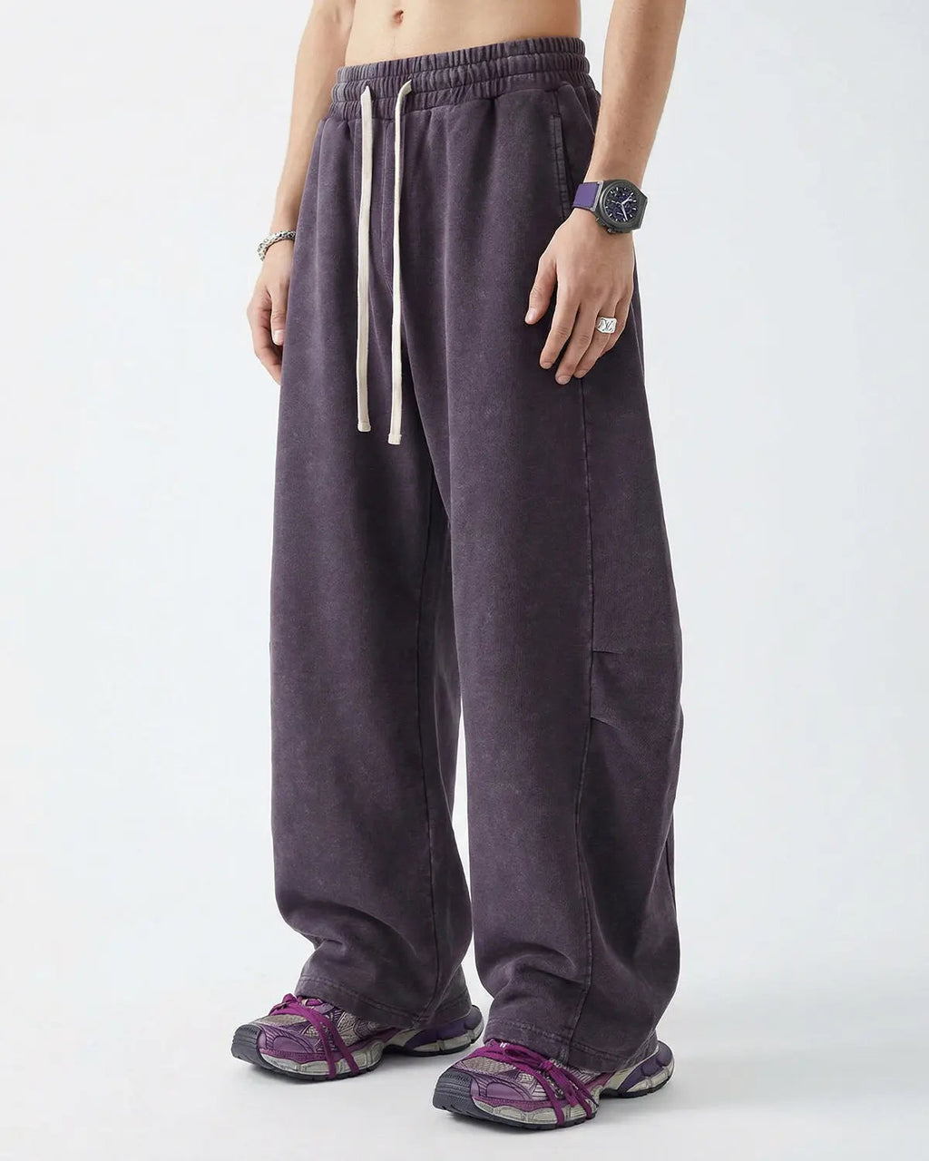 Khaki distressed acid washed barrel sweatpant from Flation Streetwear, showing relaxed fit and textured fabric.