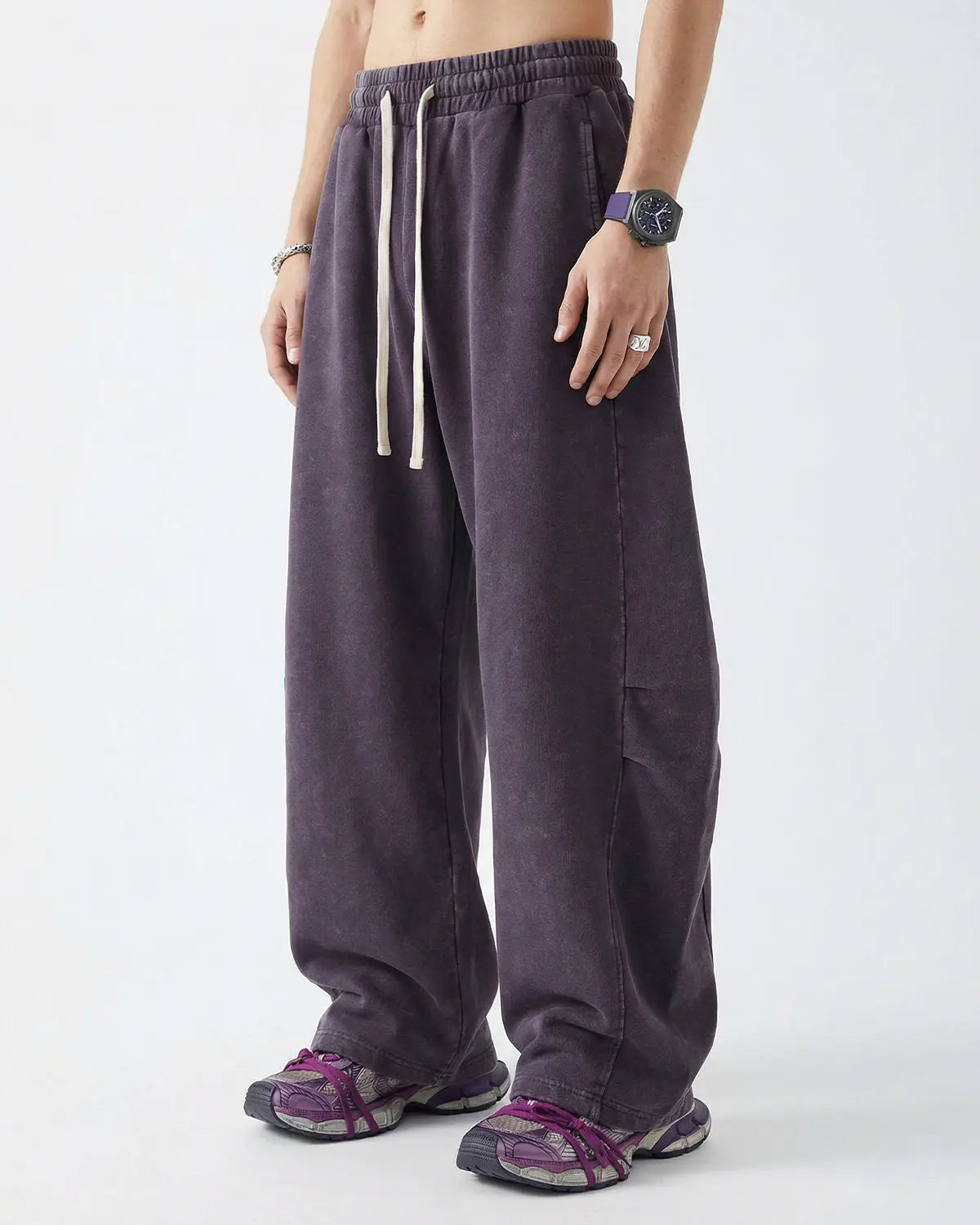Khaki distressed acid washed barrel sweatpant from Flation Streetwear, showing relaxed fit and textured fabric.
