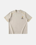 Light apricot Flation streetwear graphic tee with contrasting stitching and bold graphic design.