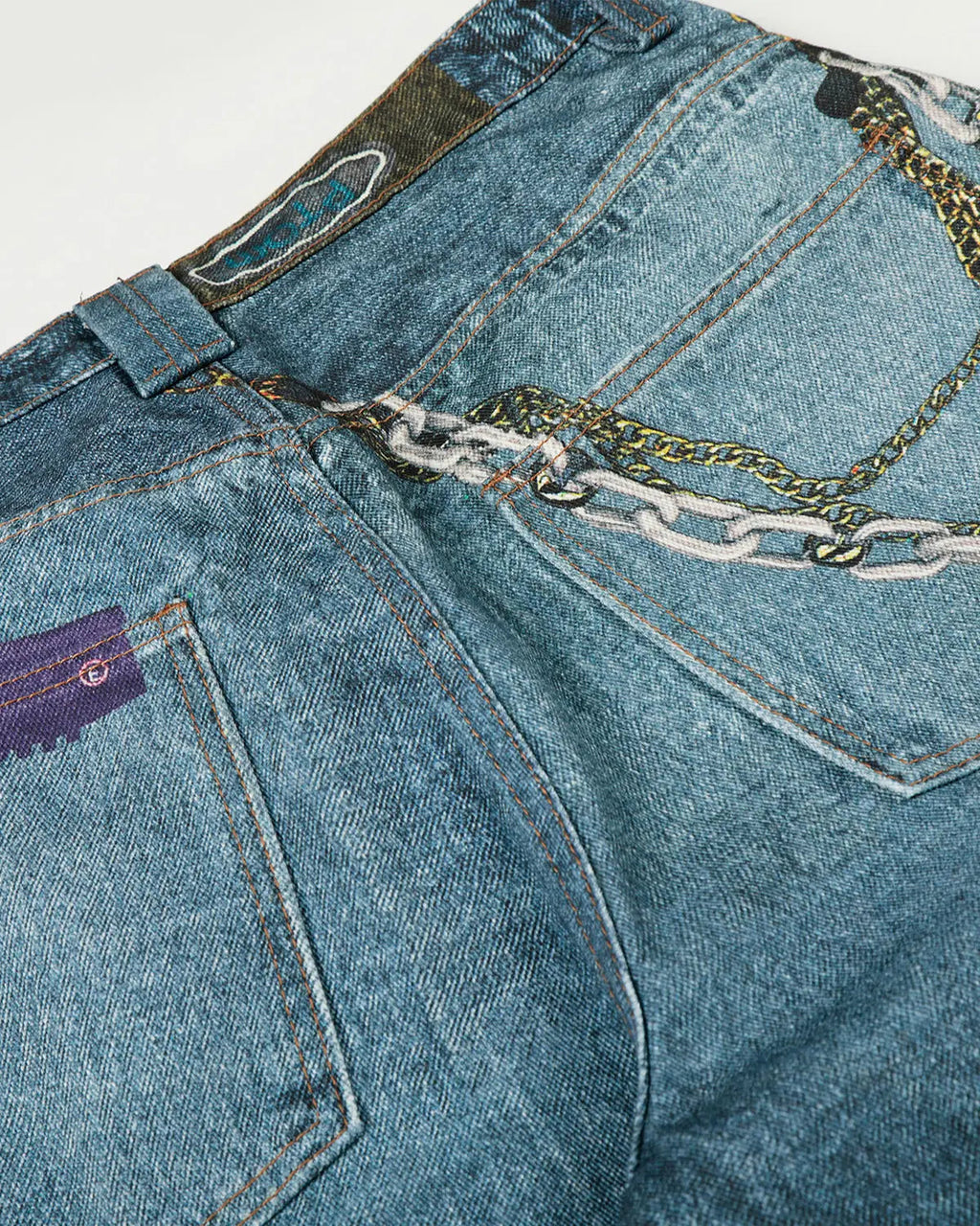 Light blue 3D print chain barrel jeans by Flation Streetwear, showcasing a relaxed fit with detailed chain design accents.