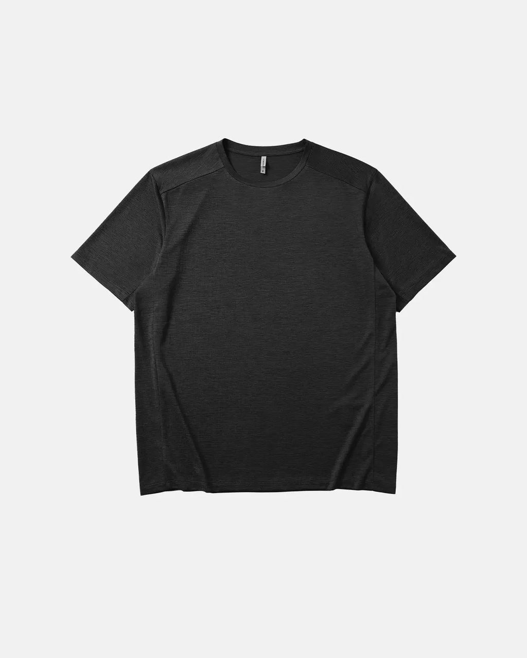 Black AirFlow Rudolf breathable tee by Flation, showcasing lightweight fabric and modern design for comfortable wear.