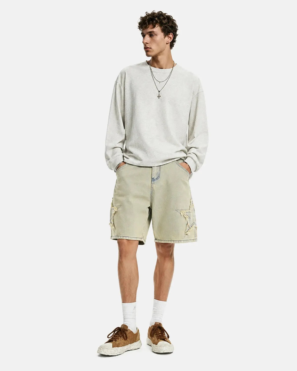 Muddy yellow Star Patch distressed baggy Jorts by Flation Streetwear, featuring a relaxed fit and star patch details.