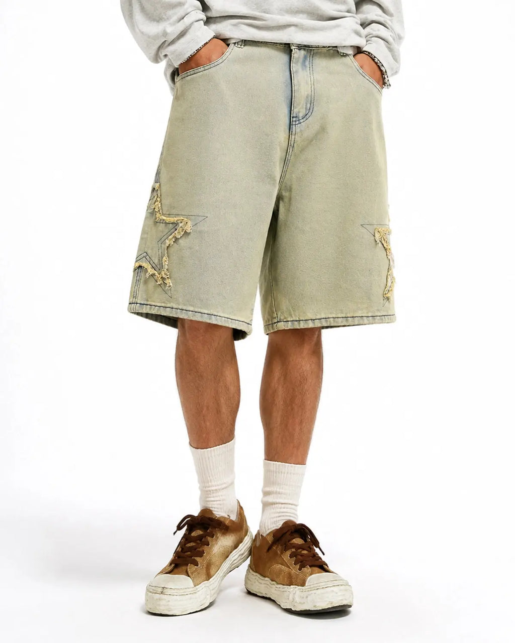 Muddy yellow star patch distressed baggy Jorts by Flation Streetwear with ripped details and relaxed fit.