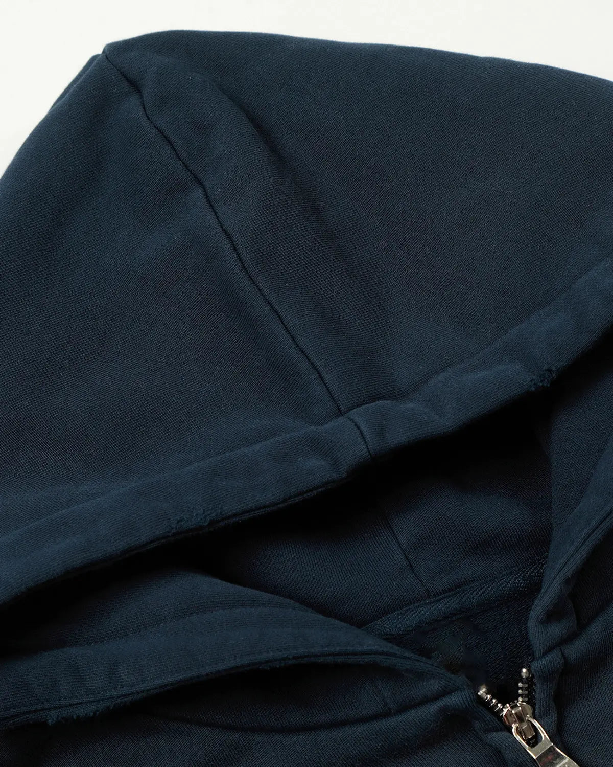 Navy blue distressed washed printed zip-up hoodie by Flation Streetwear with graphic design and casual fit.