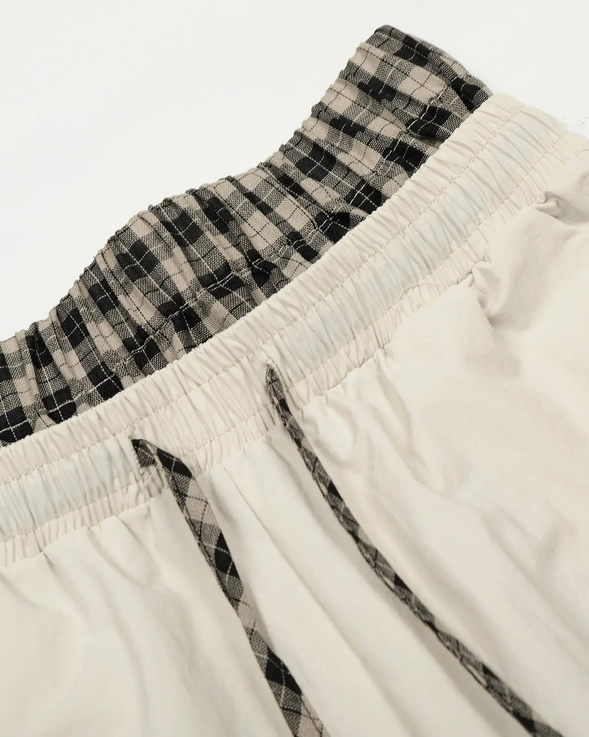 Flation plaid double waist baggy track pants with relaxed fit and stylish pattern, perfect for streetwear fashion.