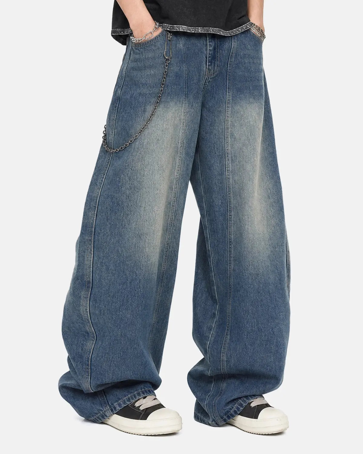 Deconstructed barrel jeans by INFLATION Streetwear, stylish pants with unique ripped and distressed details.
