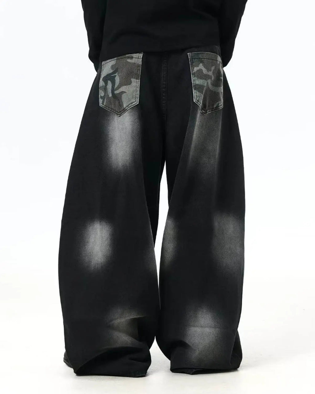 Flation Spray Graphic Camo Barrel Jeans, streetwear pants with bold camo pattern and relaxed fit, shown from the front.