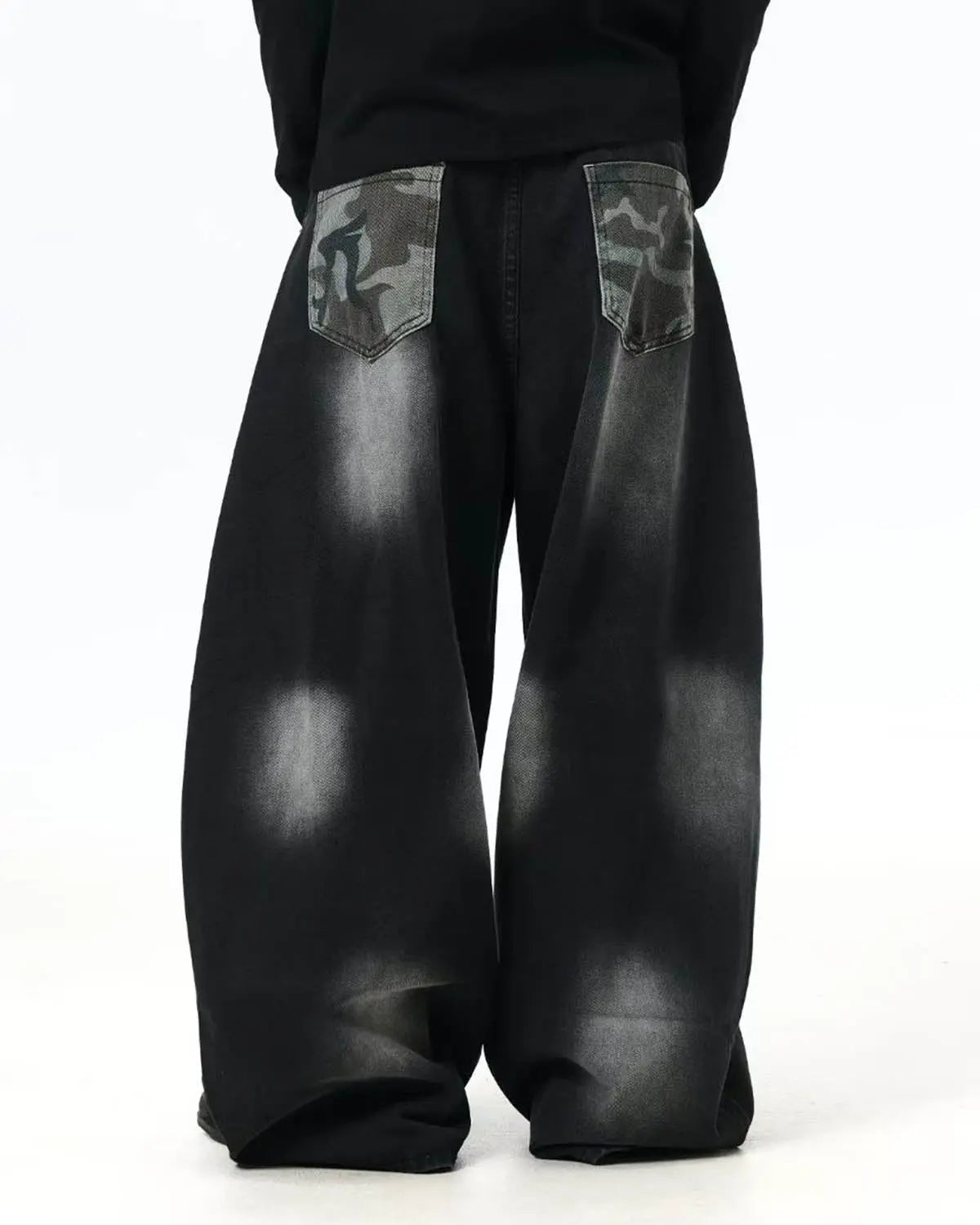 Flation Spray Graphic Camo Barrel Jeans, streetwear pants with bold camo pattern and relaxed fit, shown from the front.