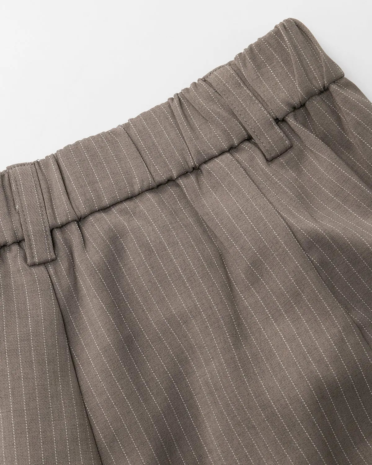 INFLATION pinstripe pleated tailored shorts, stylish pants with vertical stripes and a high-waisted fit, perfect for streetwear fashion.