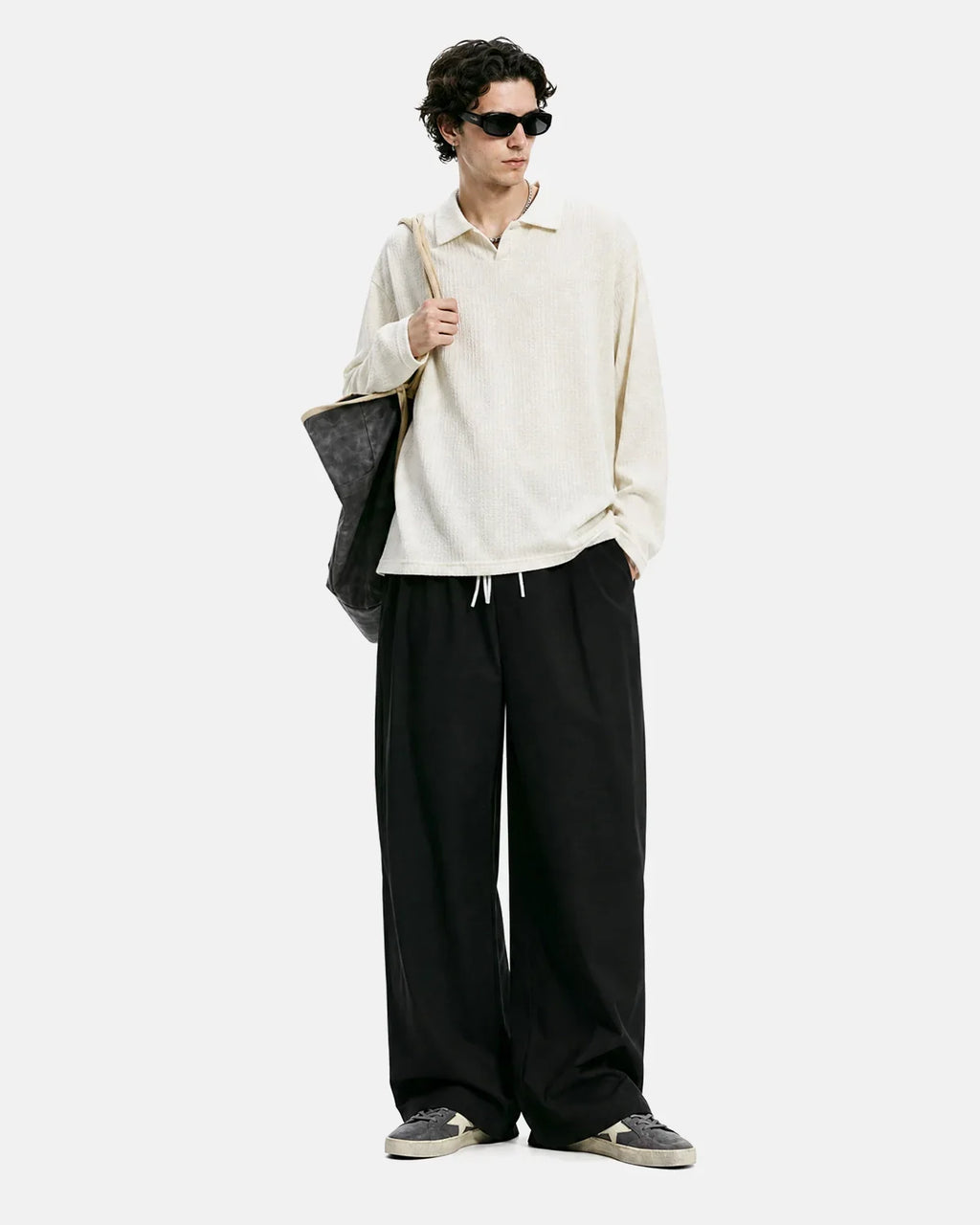 Black Flation AirFlow Cooling Wide-Leg Pants made of lightweight fabric with a relaxed fit and wide-leg design for comfort.