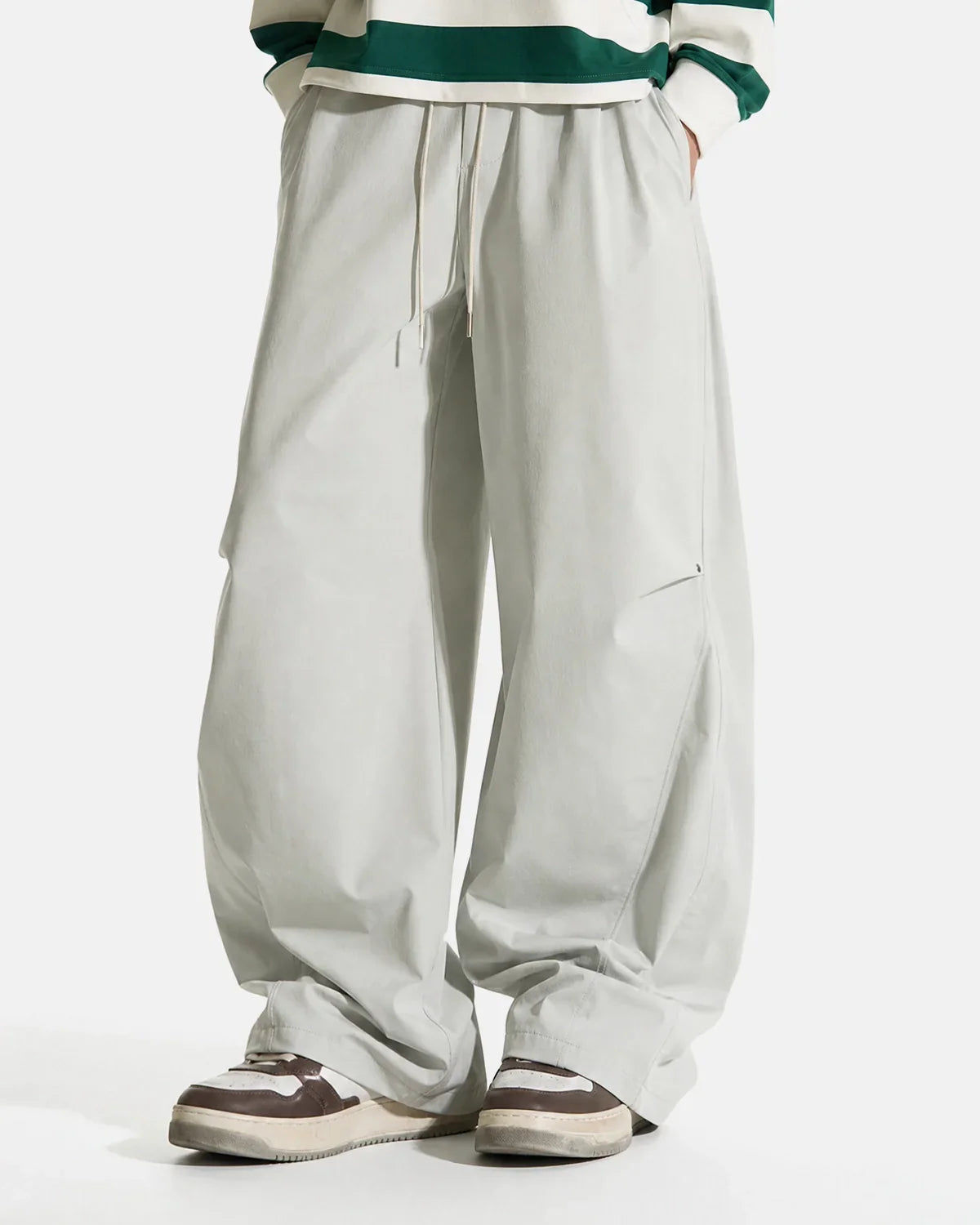 Black Flation AirFlow Stretch Cooling Parachute Pants with breathable, lightweight fabric and relaxed fit for comfort and style.