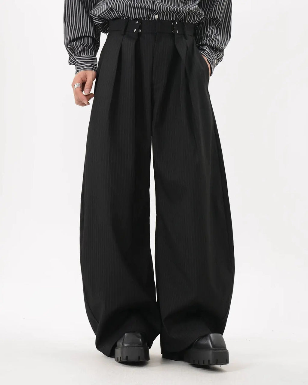 Black striped barrel suit pants by Flation Streetwear, featuring a relaxed fit and stylish striped pattern.