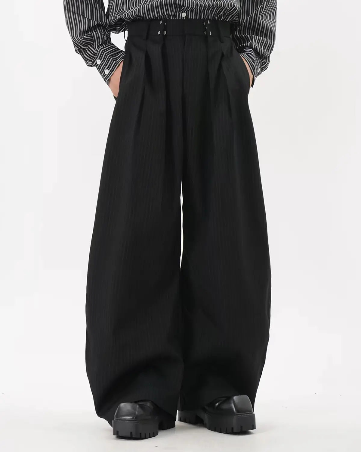Black striped barrel suit pants by Flation Streetwear, featuring a relaxed fit and bold vertical stripe pattern.