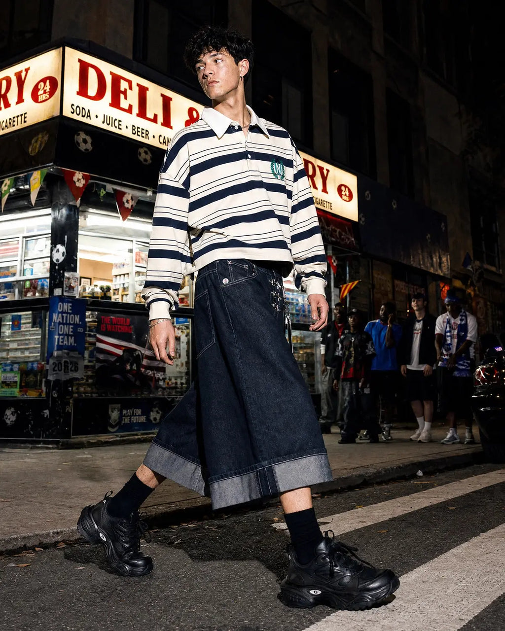Black buckle detail raw denim jorts by Flation Streetwear, showcasing distressed fabric and stylish design with a buckle accent.