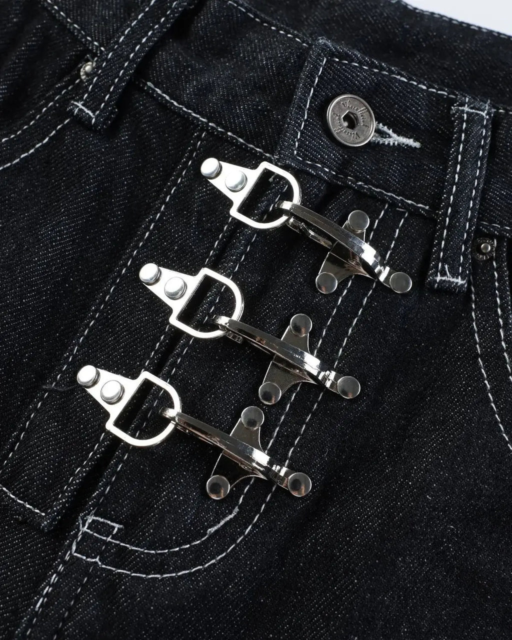 Black raw denim jorts with buckle detail from Flation Streetwear, showcasing distressed fabric and casual streetwear style.