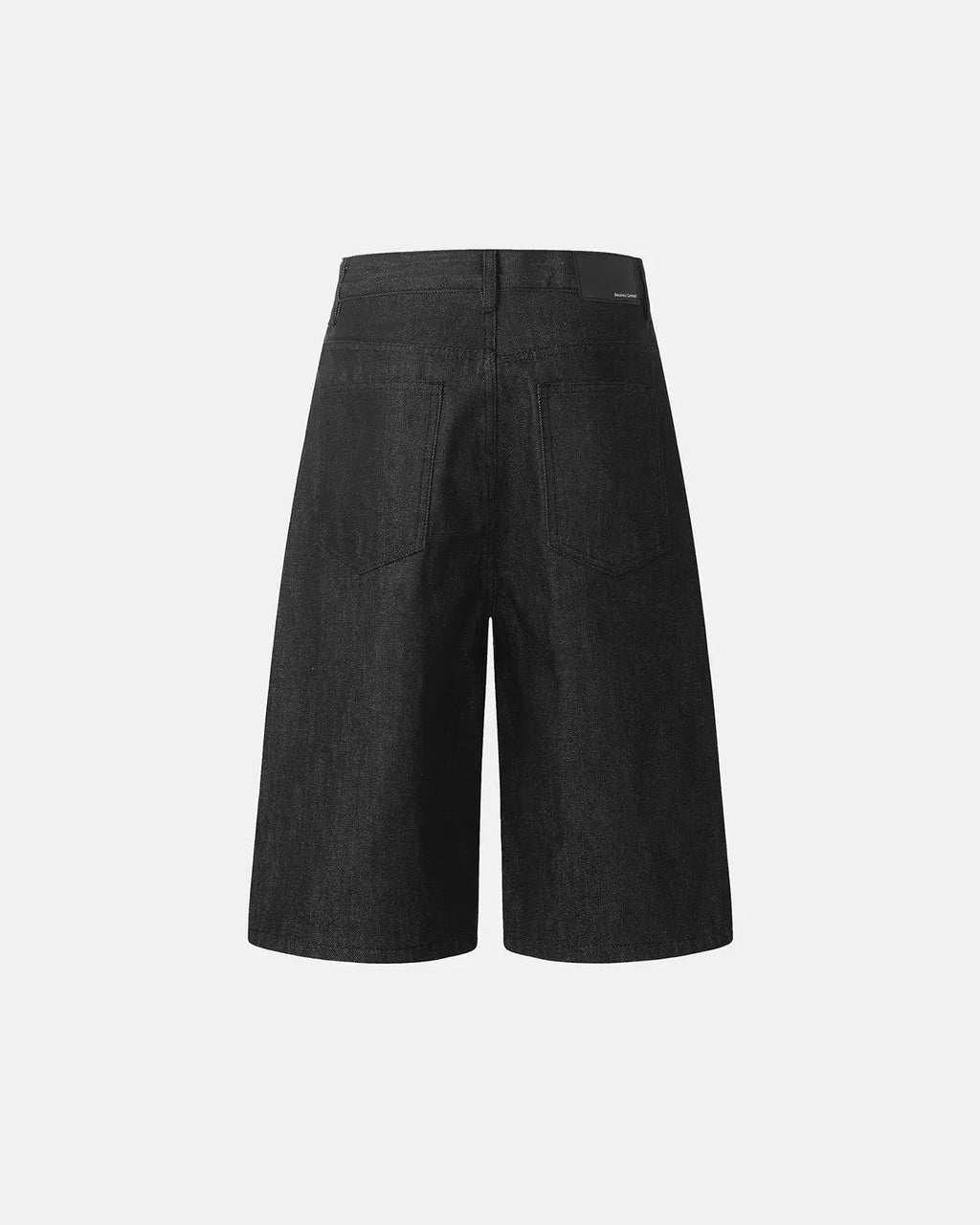 Black Flation baggy denim jorts with button details, streetwear style, relaxed fit, shown from the front view.