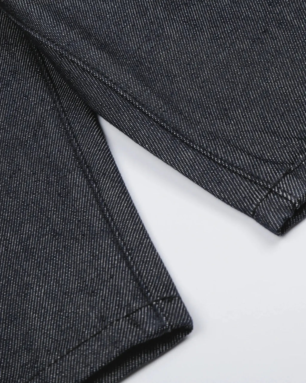Black Flation baggy denim jorts with button details, streetwear style, relaxed fit, and distressed finish.