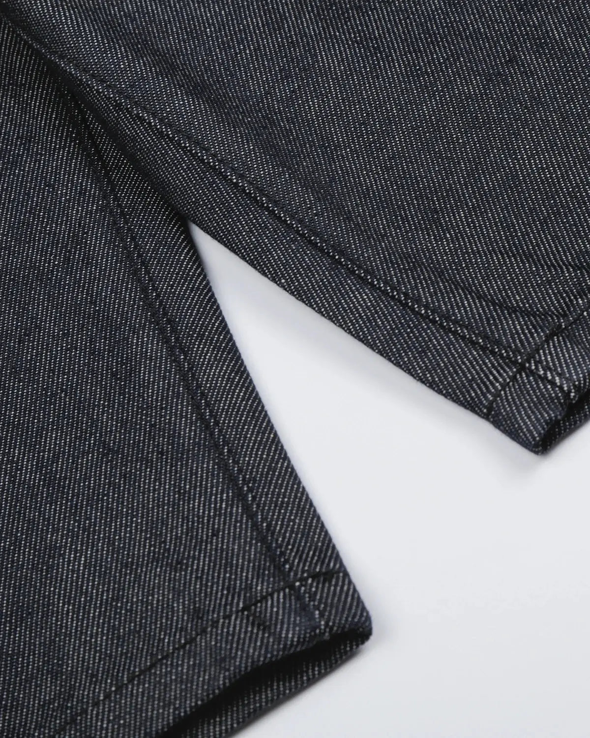Black Flation baggy denim jorts with button details, streetwear style, relaxed fit, and distressed finish.