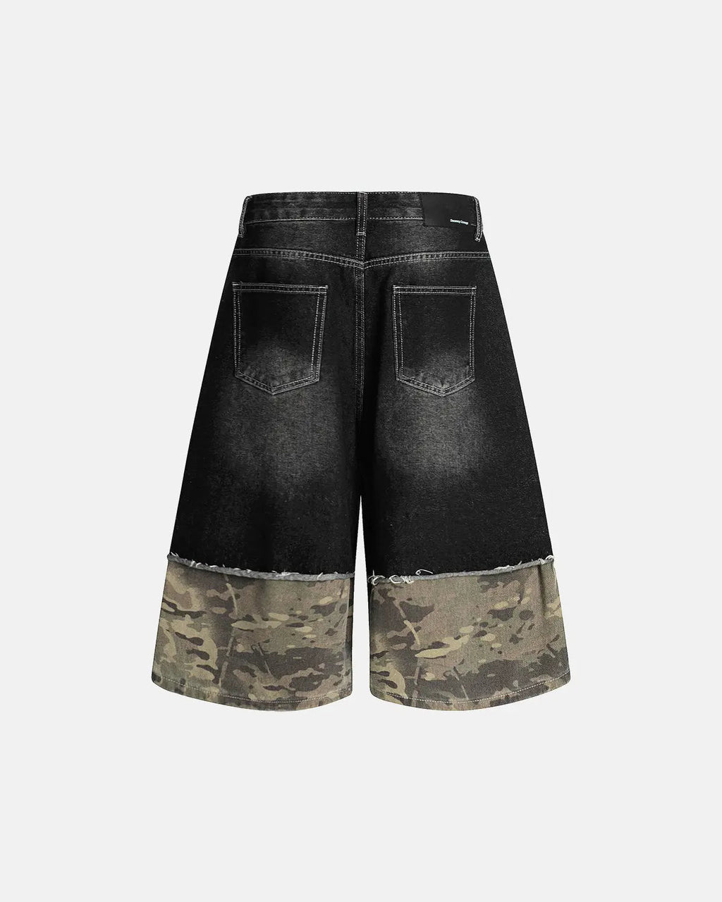 Black camo patchwork washed denim jorts by Flation, stylish streetwear pants with a relaxed fit and rugged denim look.