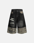 Black camo patchwork washed denim jorts by Flation Streetwear, showcasing distressed denim shorts with a rugged, urban style.