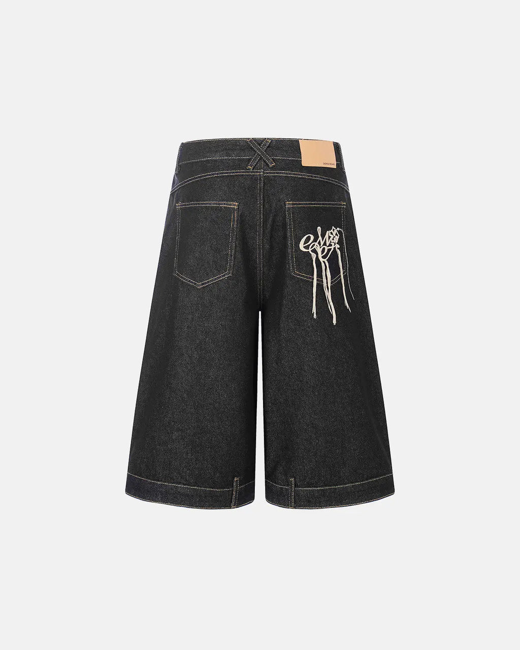 Black deconstructed raw denim jorts by Flation Streetwear, casual pants with distressed details and frayed hems.