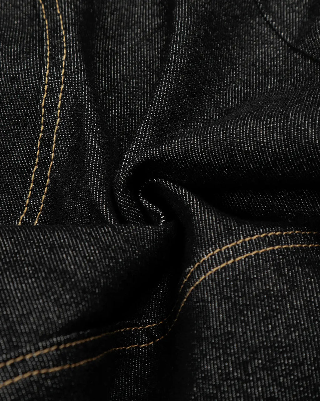 Black deconstructed raw denim jorts by Flation, casual streetwear pants with distressed detailing and frayed hems.