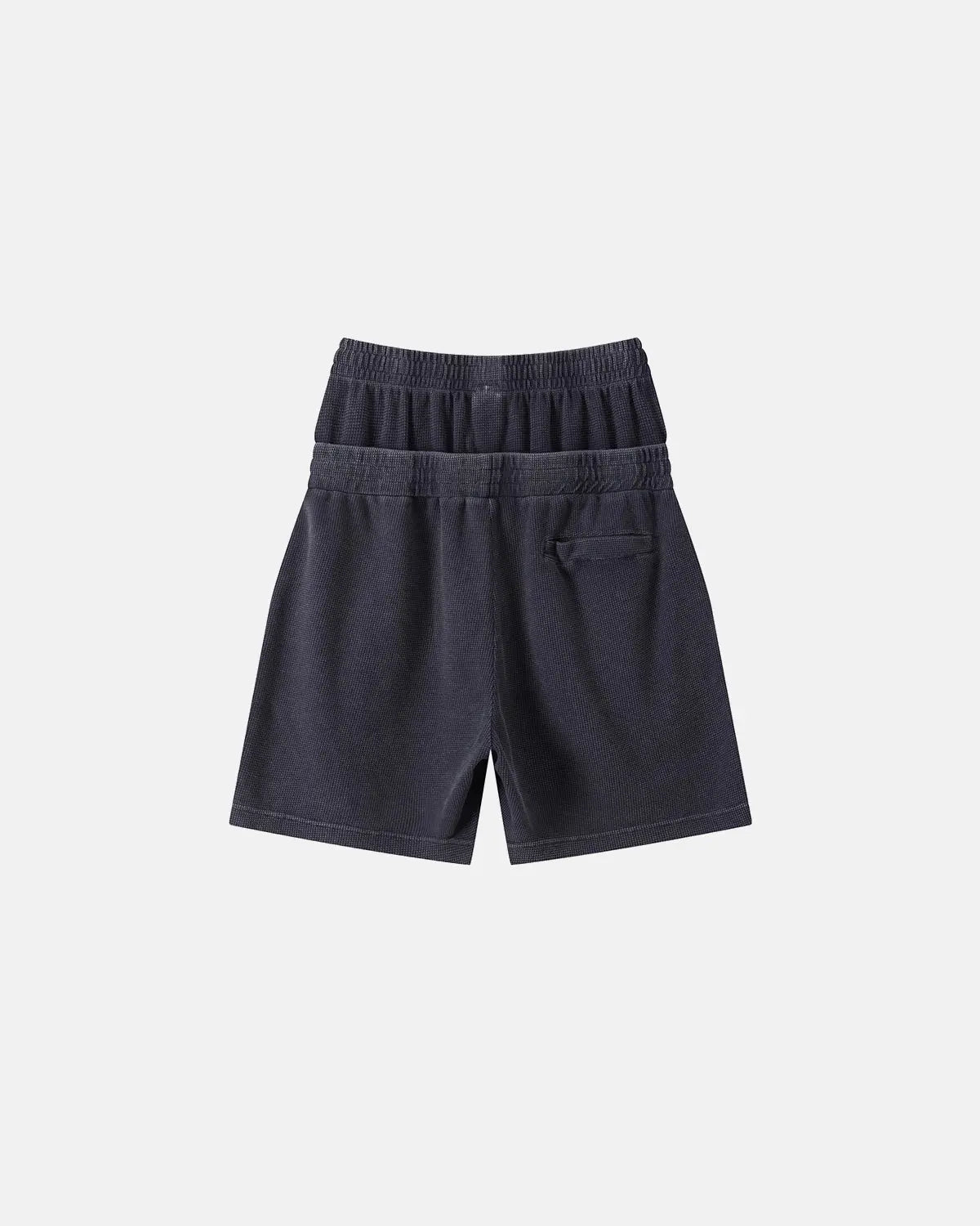 Black Flation double waist acid wash waffle shorts, casual streetwear pants with a relaxed fit and textured fabric.