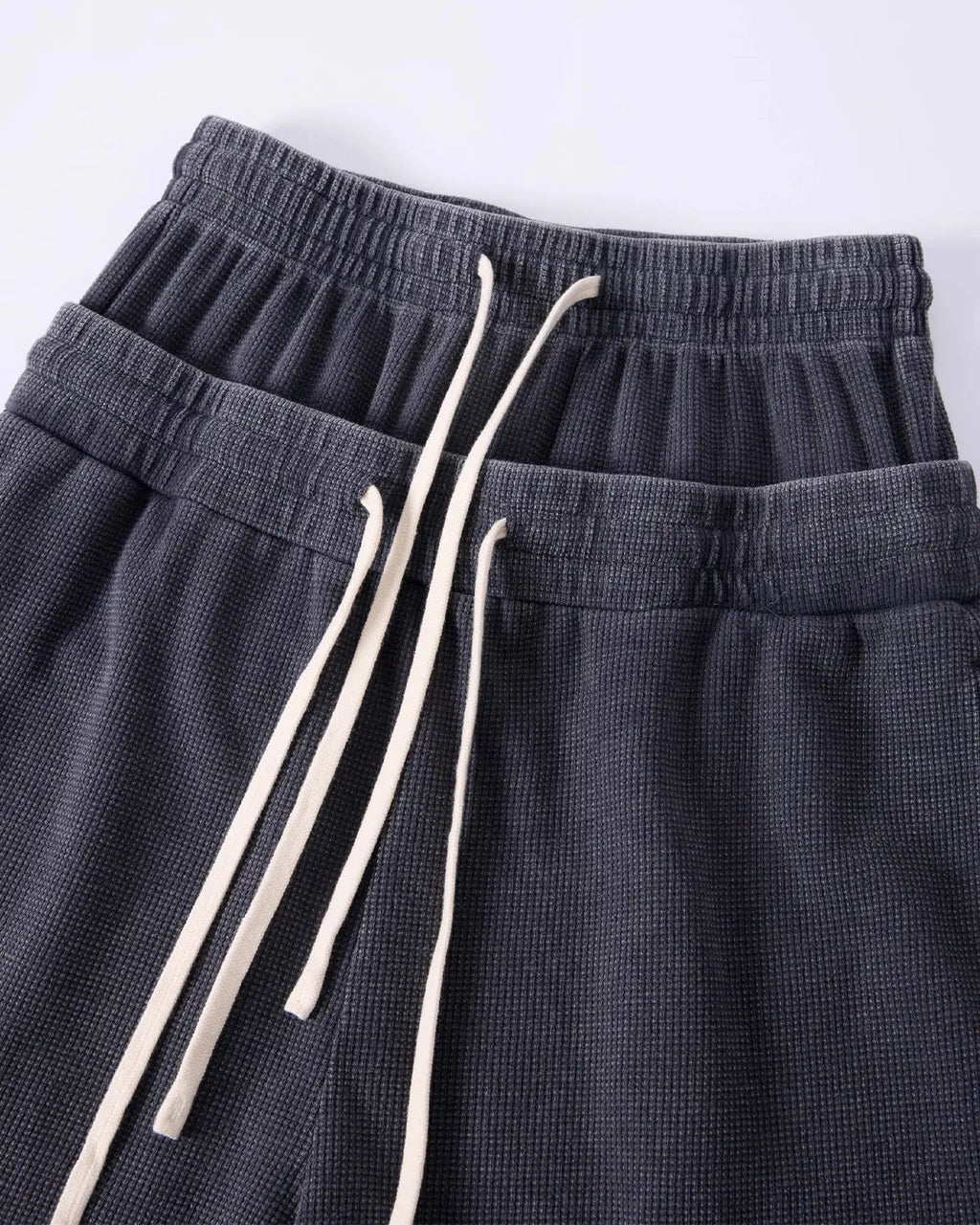 Black Flation streetwear double waist acid wash waffle shorts, casual pants with a textured, stylish design.