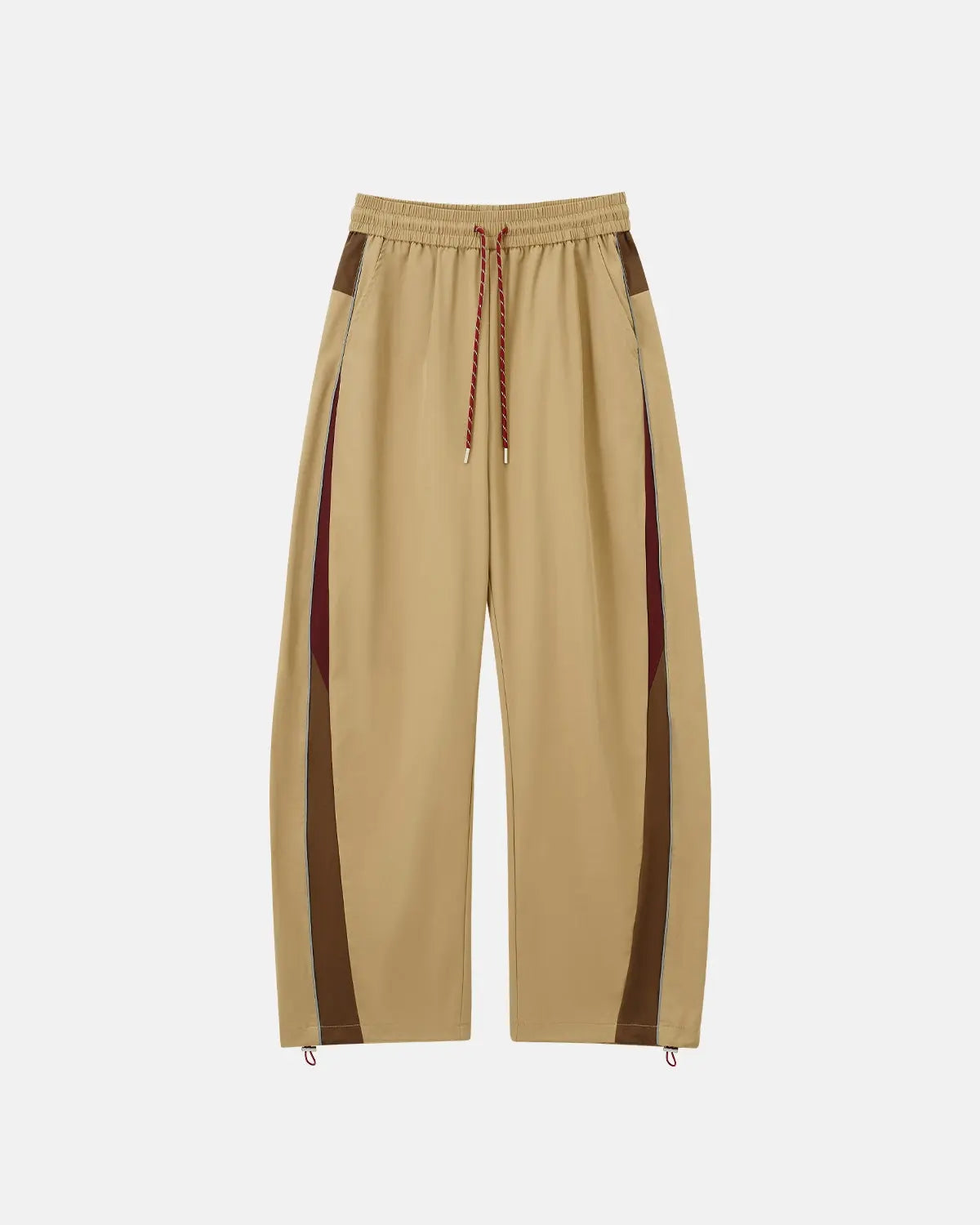 Reflective windbreaker track pants by Flation streetwear, featuring lightweight fabric, reflective details, and a tapered fit.