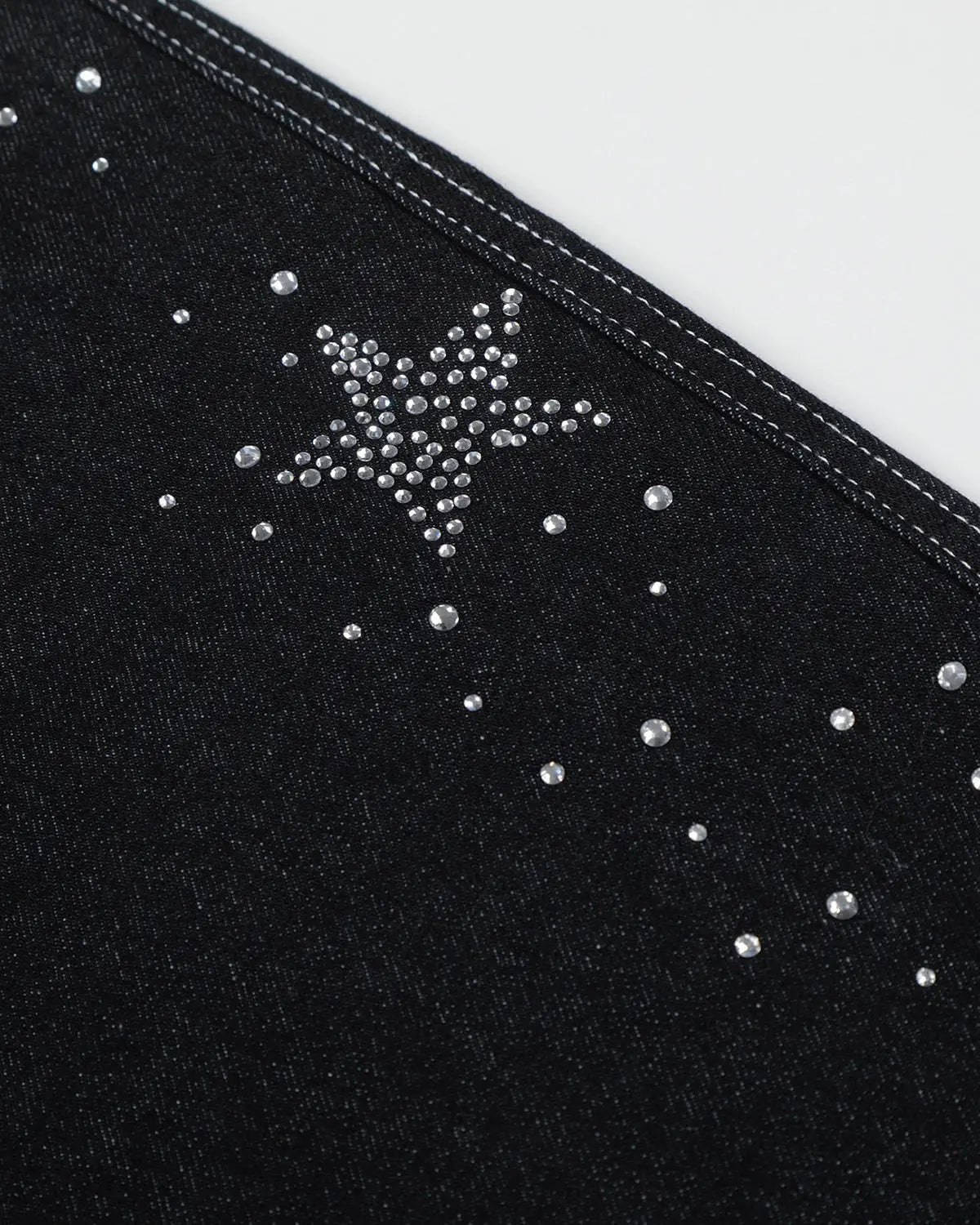 Black denim shorts with star rhinestone embellishments by Flation, stylish streetwear pants featuring sparkling star details.