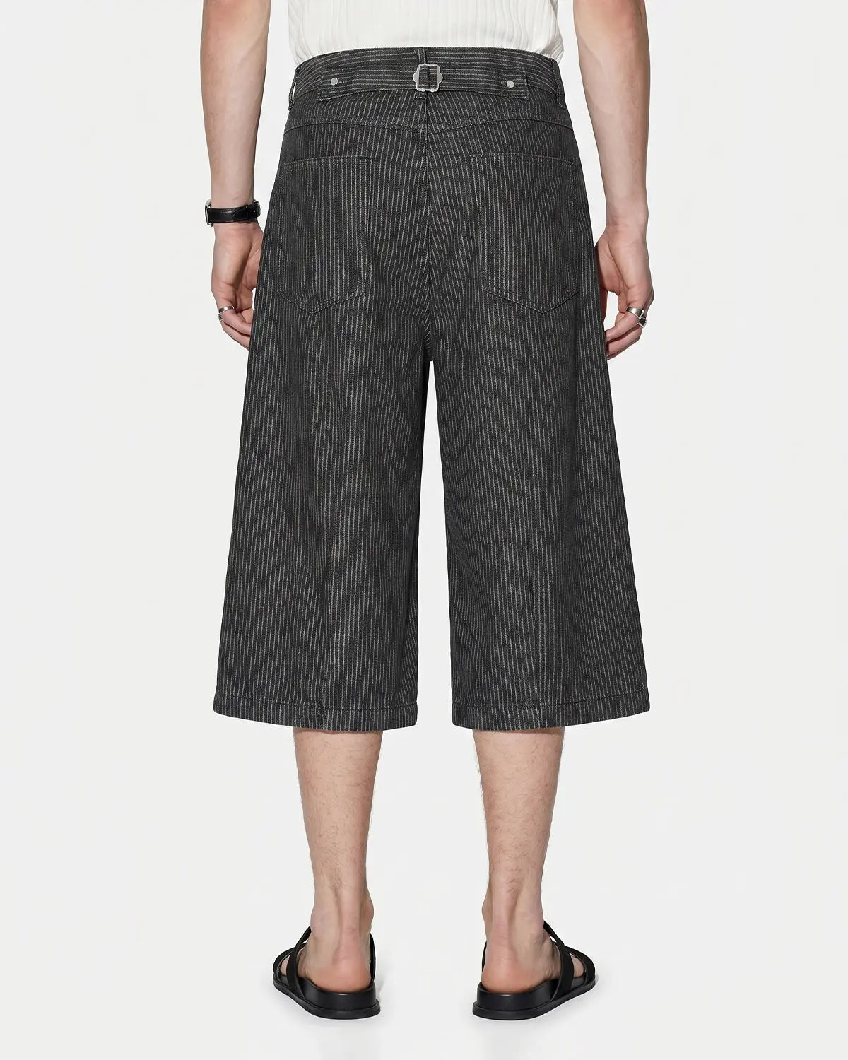 Black striped Flation streetwear baggy jorts with button fly, casual pants with a relaxed fit and bold pattern.