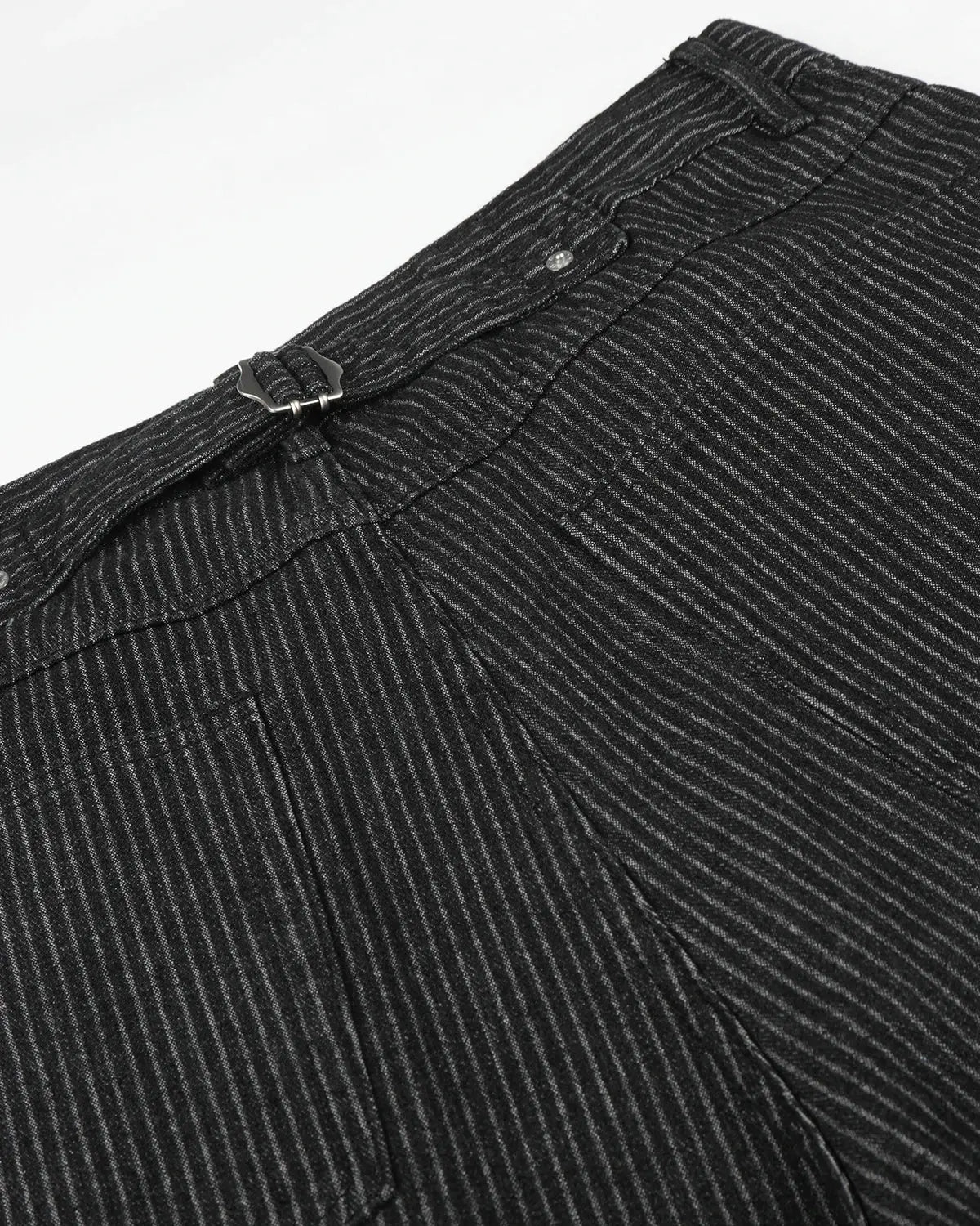Black striped Flation baggy jorts with button fly, featuring a relaxed fit and casual streetwear style.