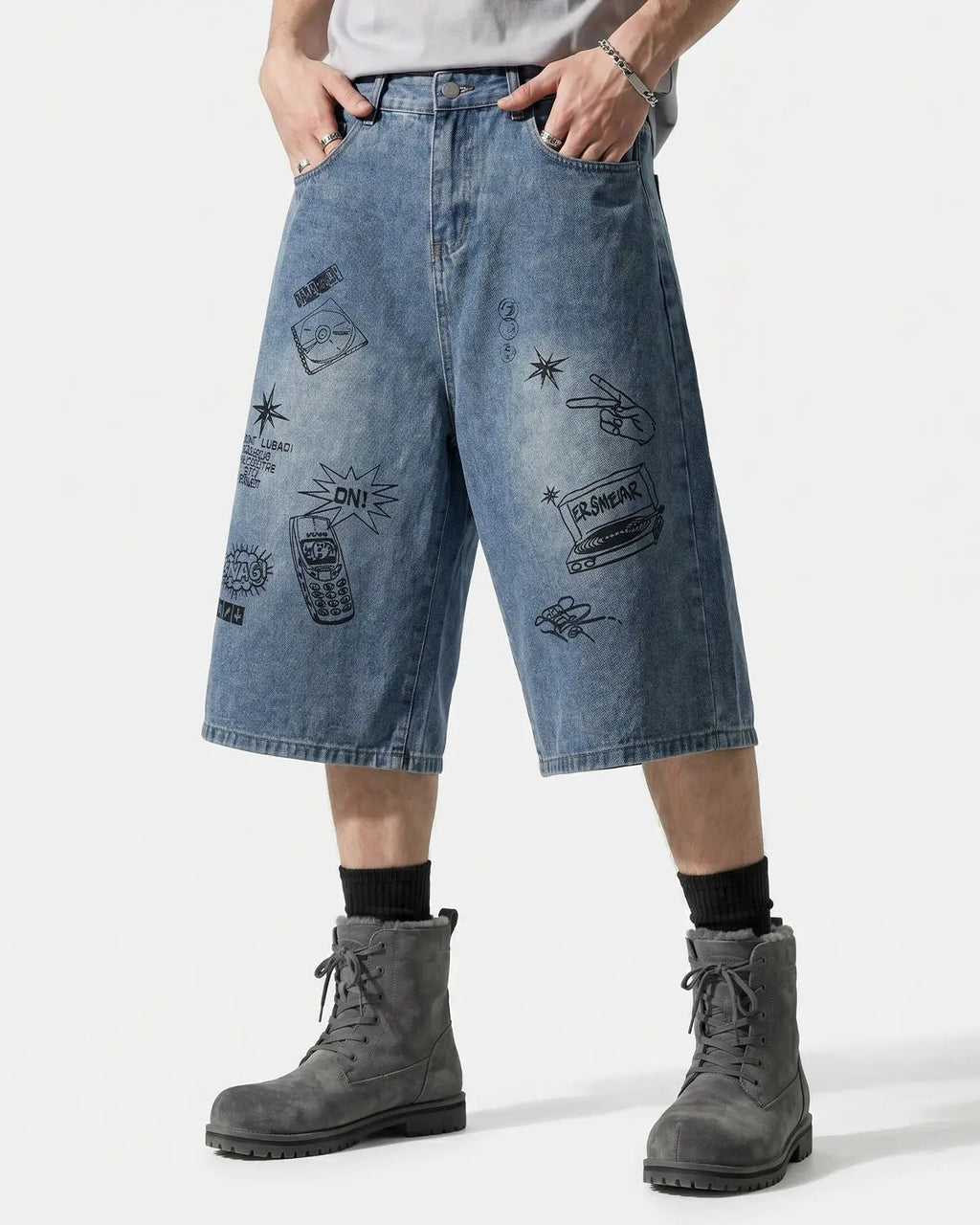 Blue washed graffiti longline jorts by Flation Streetwear, casual pants with a relaxed fit and street art-inspired design.