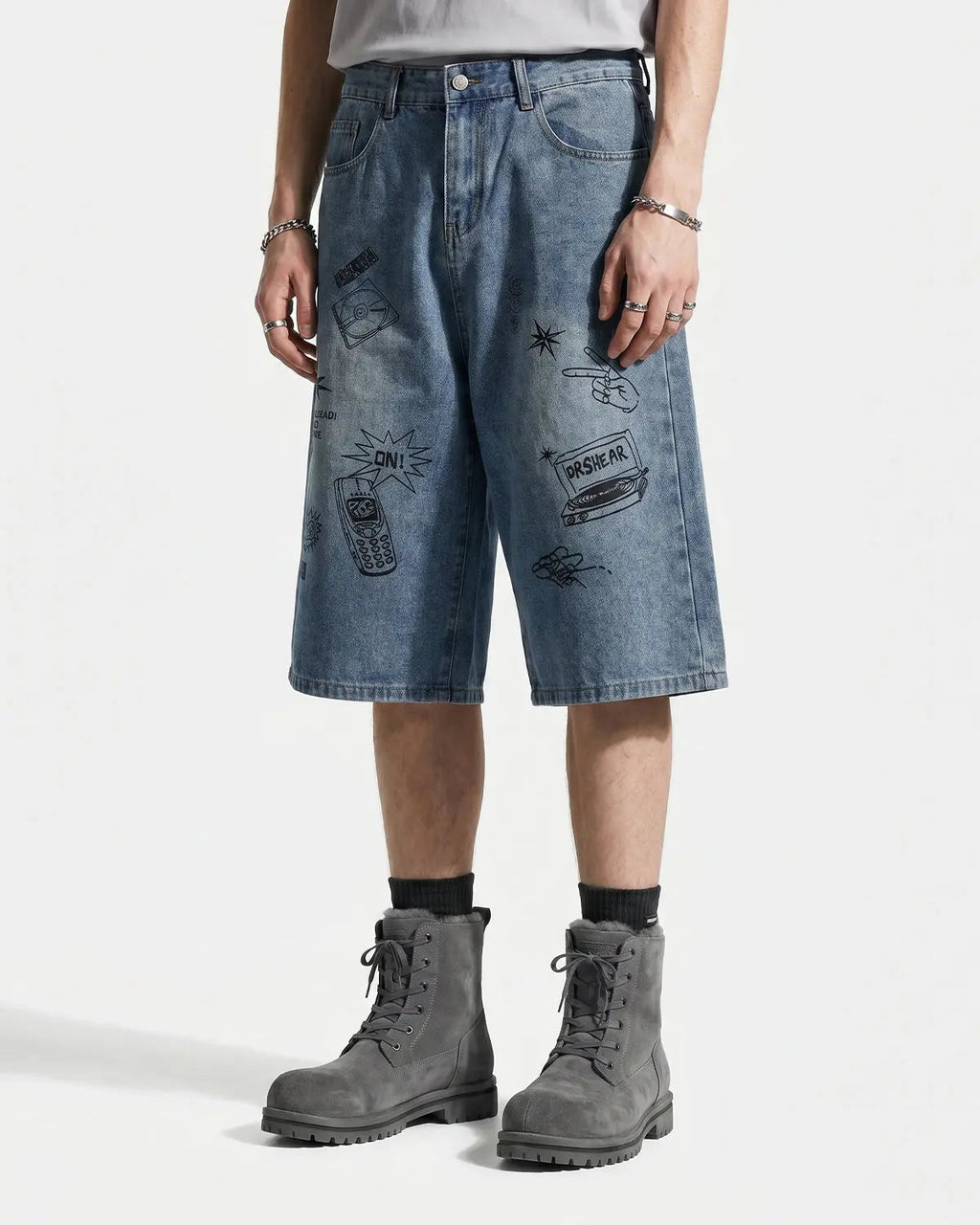 Blue washed graffiti longline jorts by Flation Streetwear, casual denim pants with artistic graffiti design and relaxed fit.