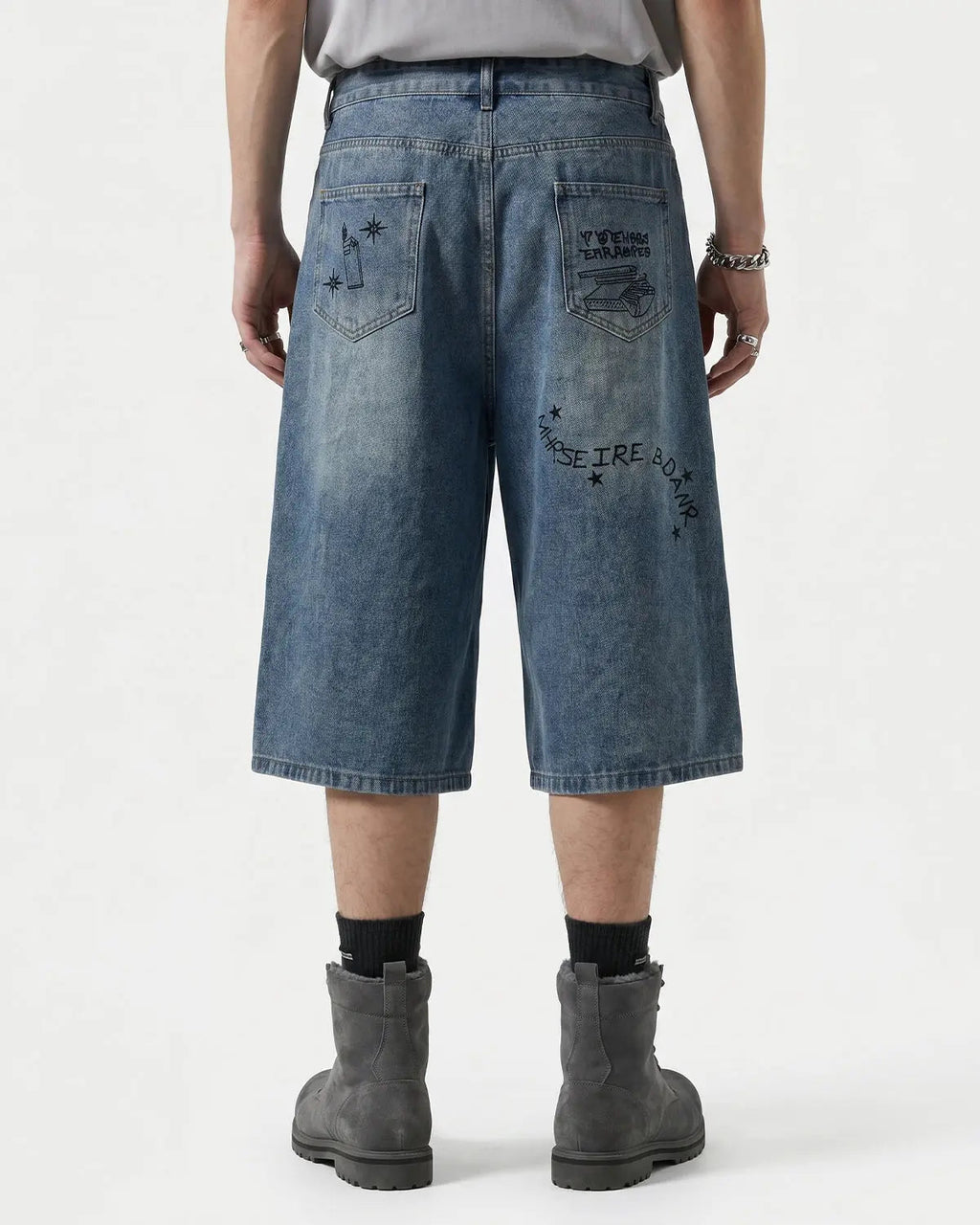 Blue washed graffiti longline jorts by Flation Streetwear, casual pants with graffiti design, relaxed fit, and streetwear style.