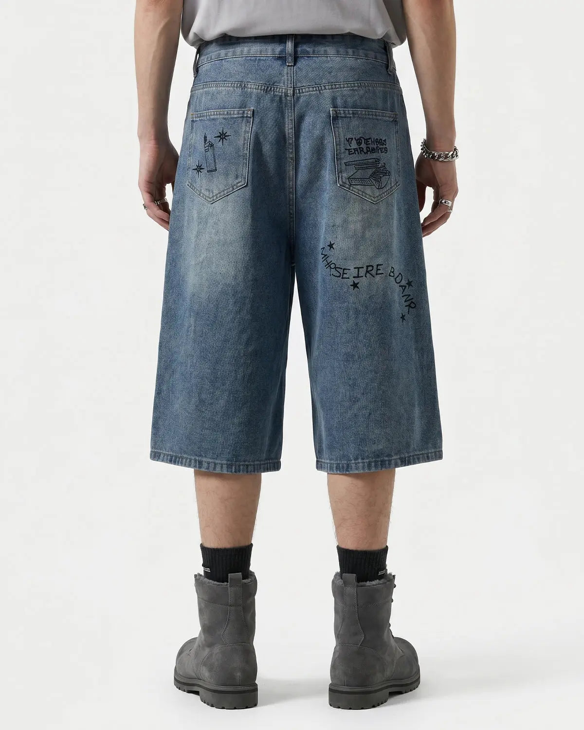 Blue washed graffiti longline jorts by Flation Streetwear, casual pants with graffiti design, relaxed fit, and streetwear style.