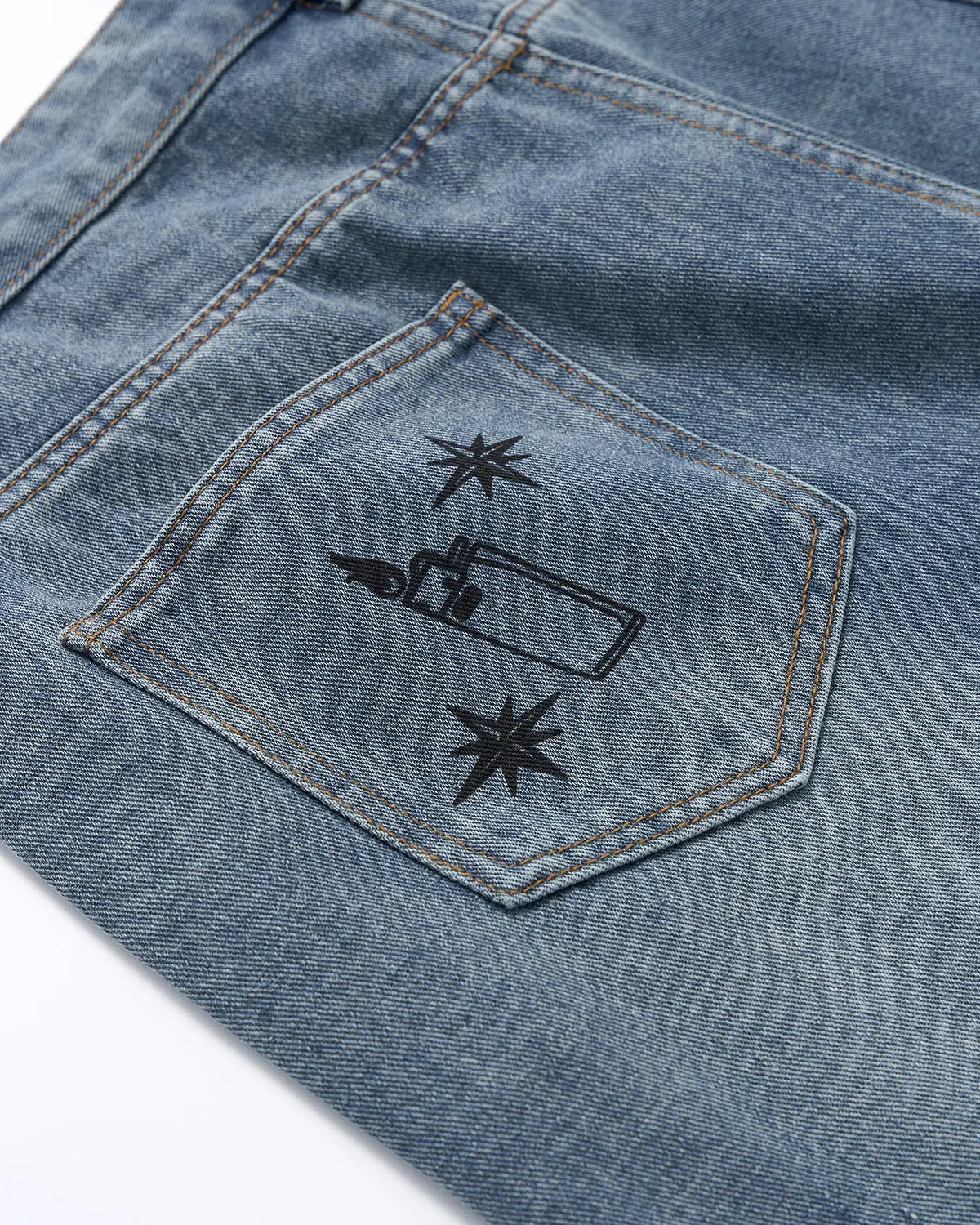 Blue washed graffiti longline jorts by Flation Streetwear, casual denim pants with graffiti design and extended length.