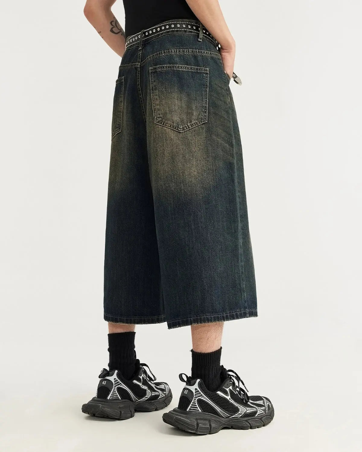 Acid washed longline baggy denim jorts by Flation Streetwear, featuring a relaxed fit and distressed denim fabric.