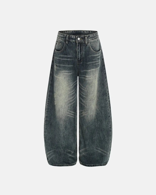 Acid washed ripped baggy barrel jeans by Flation Streetwear, showing distressed denim with a relaxed, oversized fit.