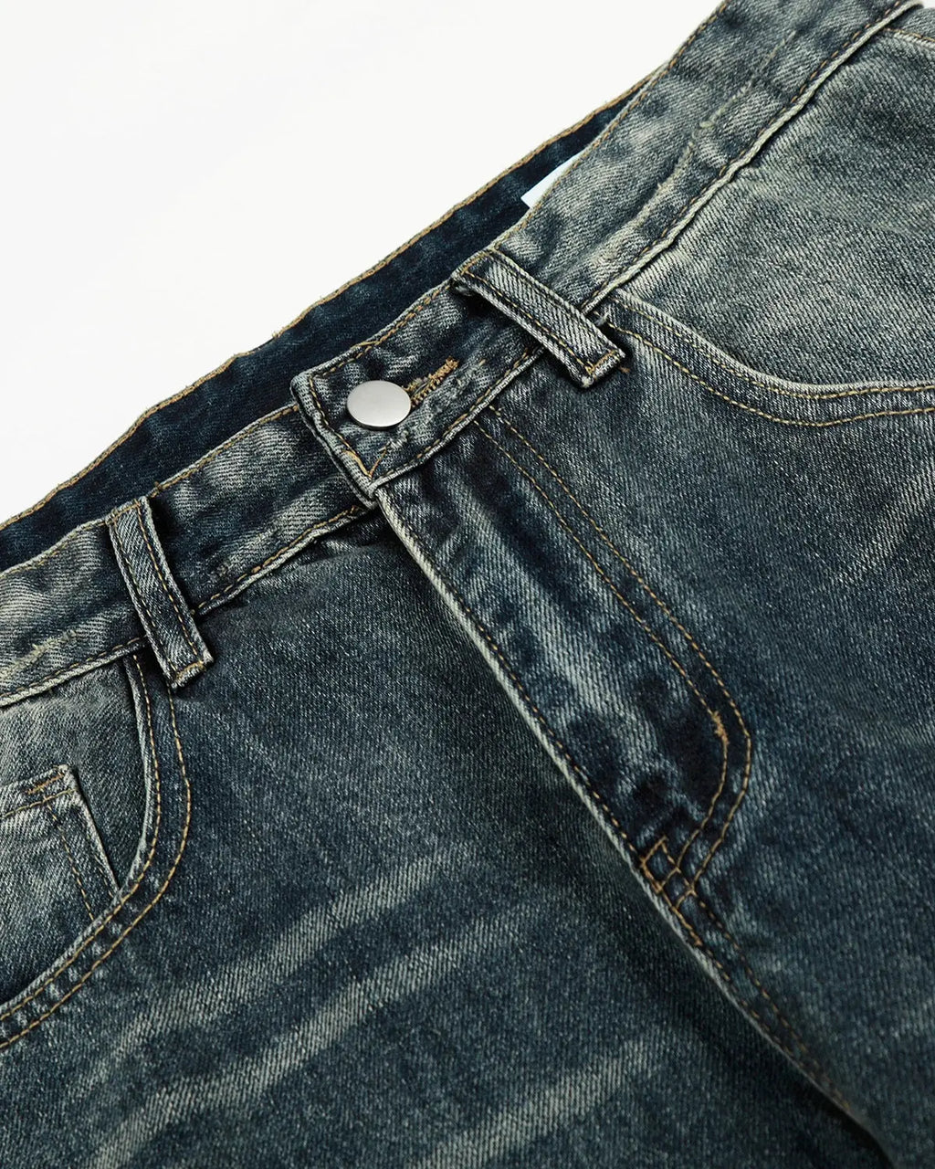 Acid washed ripped baggy barrel jeans by Flation Streetwear, showing distressed denim with a relaxed, oversized fit.