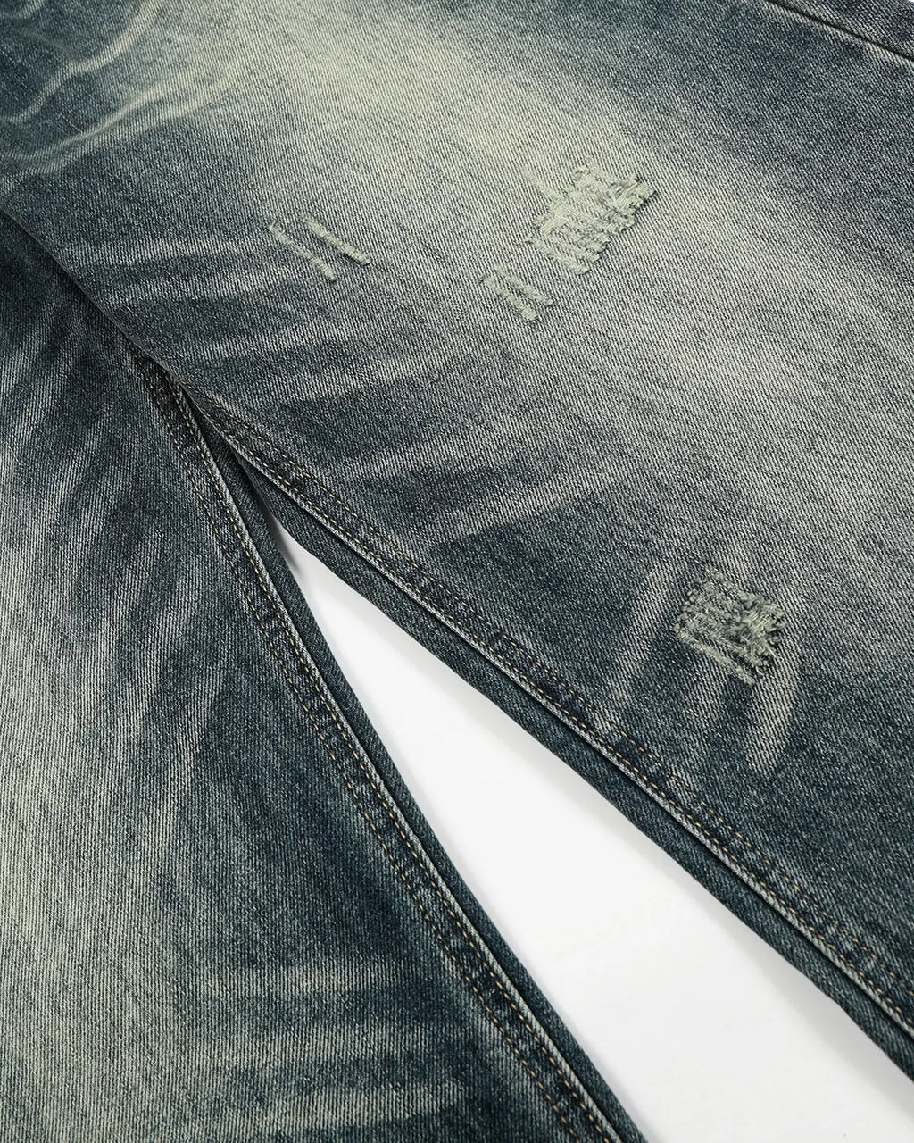 Acid washed ripped baggy barrel jeans by Flation Streetwear, showing distressed details and relaxed fit on denim pants.