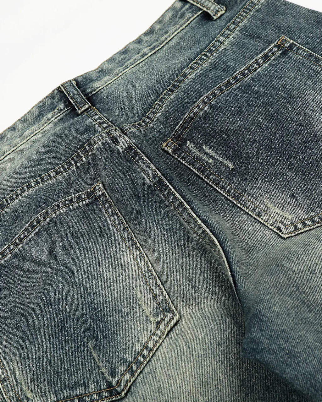 Acid washed ripped baggy barrel jeans by Flation Streetwear, showing distressed denim style and relaxed fit.